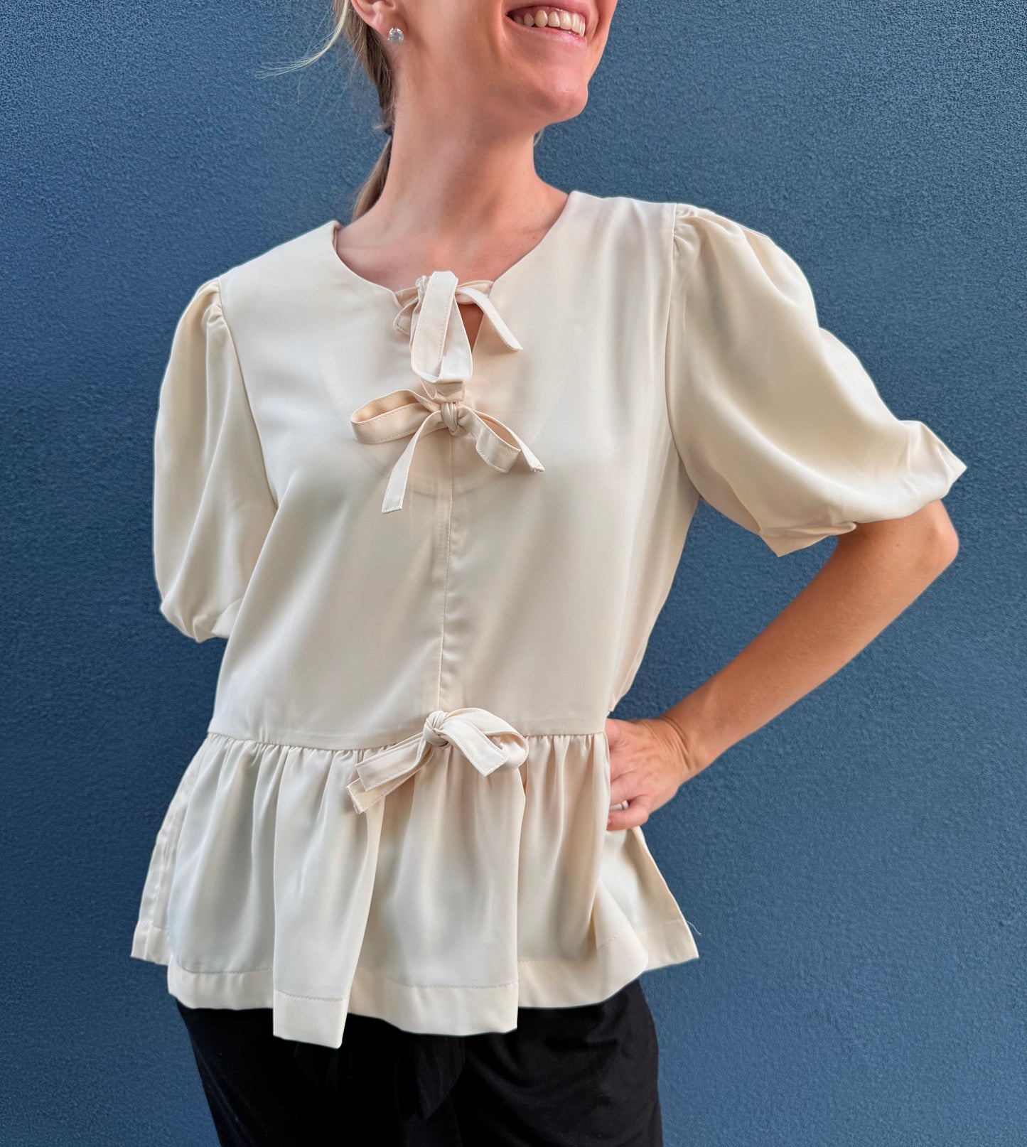 The Bow & Flow Peplum Blouse